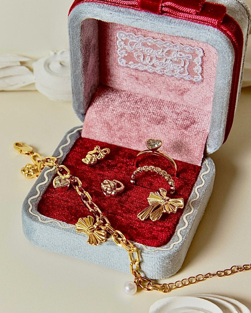 Gold jewelry set including a necklace, ring, and earrings 